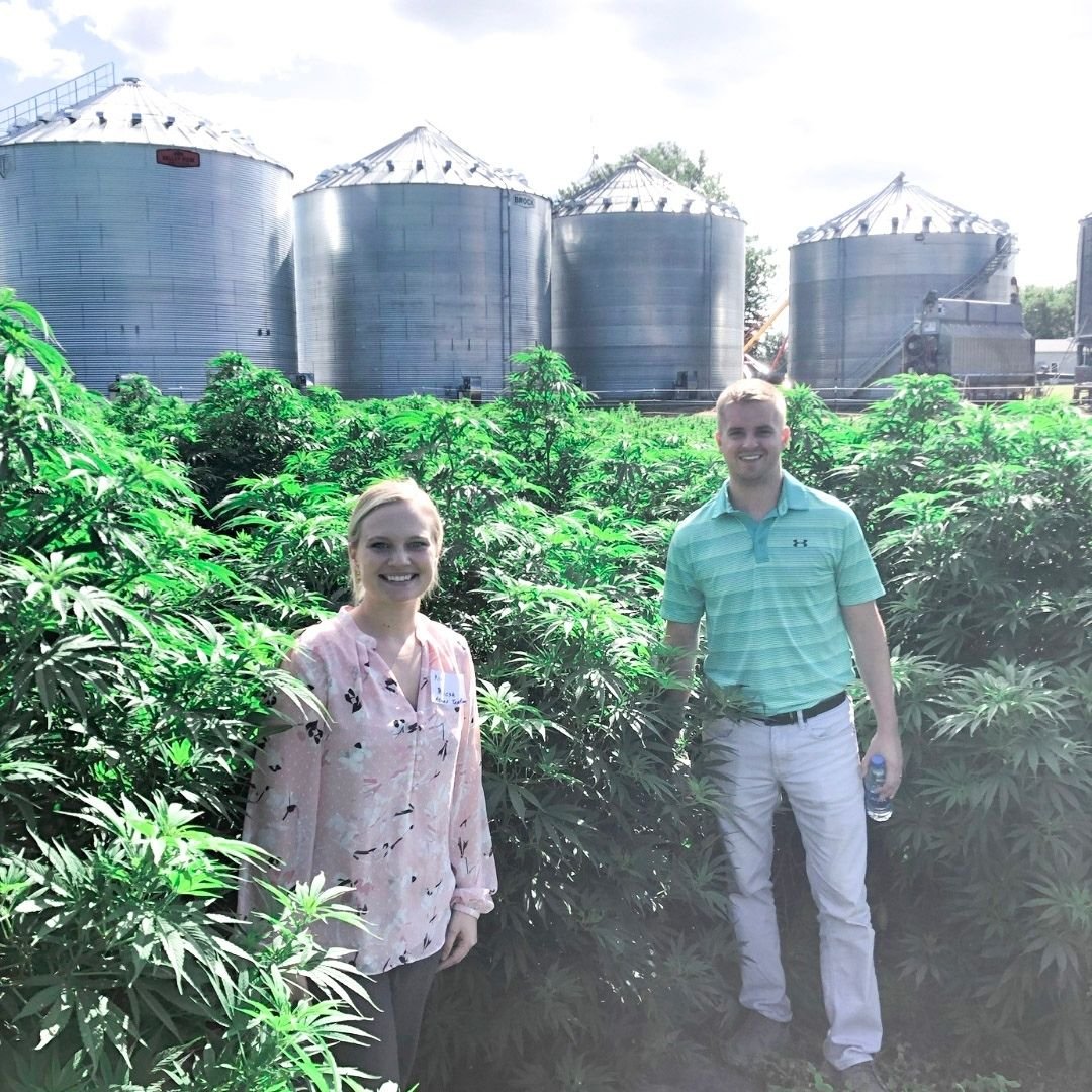 Kia and Ben in a hemp field